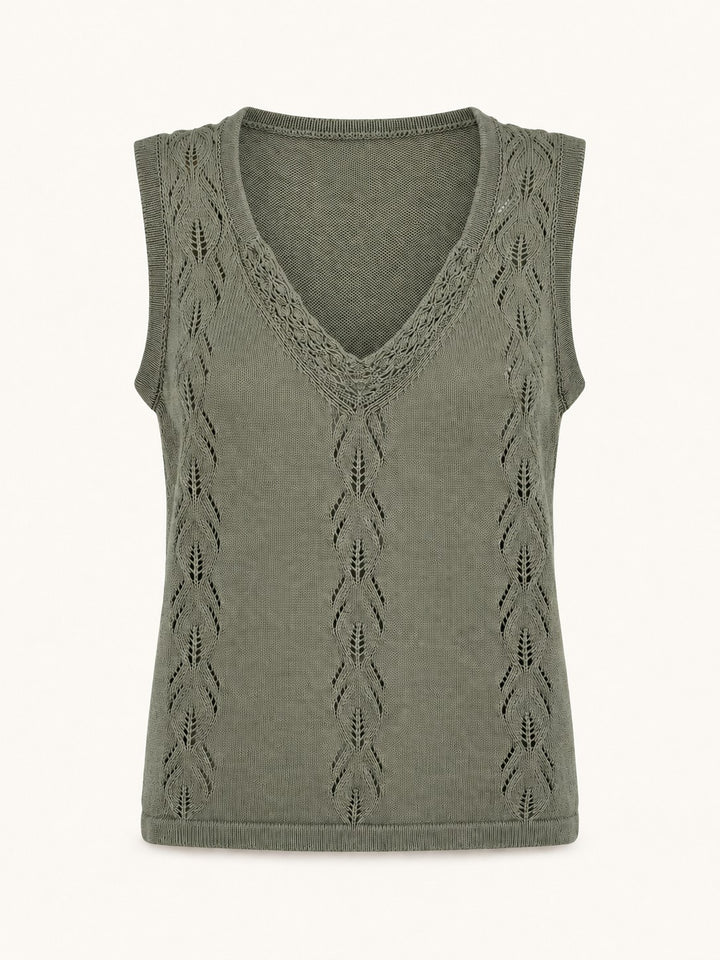 An olive green sleeveless knit top with a V-neckline and vertical openwork chevron patterns, displayed on a clean off-white background.